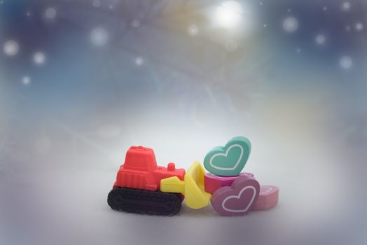 Heart shape on toy truck in bokeh background, with copy space for season greeting, valentine concept, AF point selection,blurred.