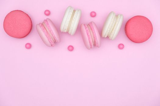 macarons on pink background, Beautiful dessert, Flat lay style with copy space to write.