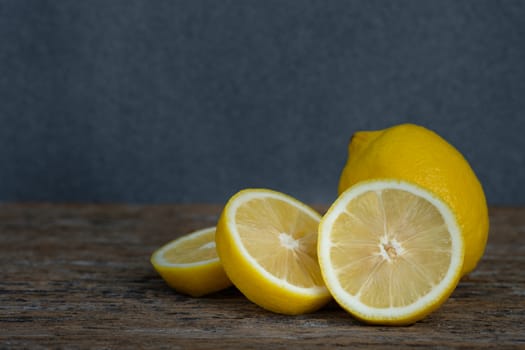 Still life with lemons on rustic low key background, Choose focal point, dark light style.