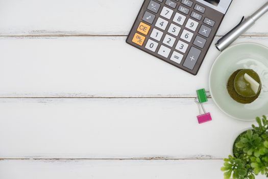 calculator and office equipment on white table background, Flat lay style with copy space to write.