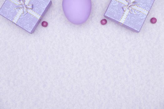 Egg shell on purple background. Minimal and easter concept, with copy space to write.