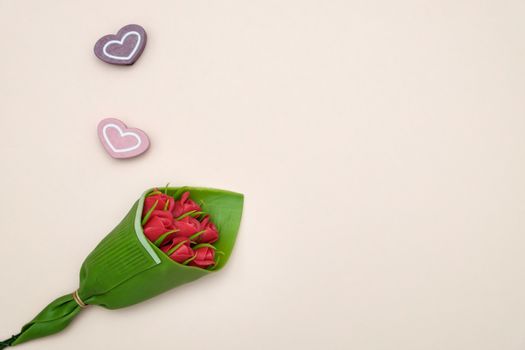 bouquet of roses and heart shape on pink background with valentine concept.