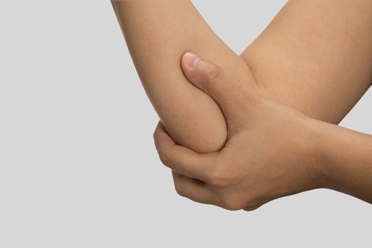 A woman touching her painful elbow, Healthcare And Medicine concept.