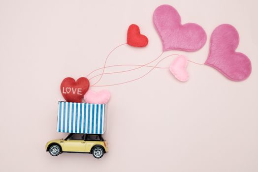 Toy car carrying heart-shape balloon, Concept of valentine day, AF point selection.