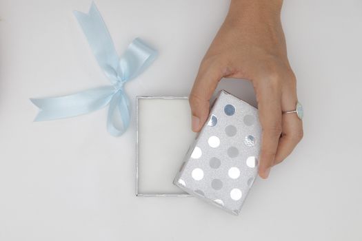 Top view two hands holding and open the empty gift box isolated white background.
