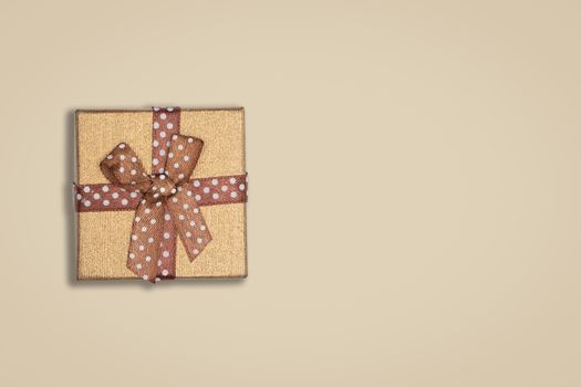 Top view of blown gift box on brown background. with copy space for text.