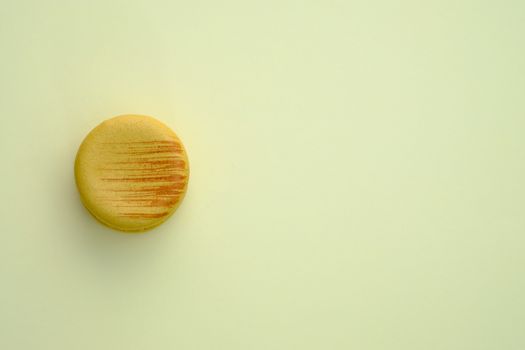 Macaroon on a yellow background. Topview, Space to write at right.