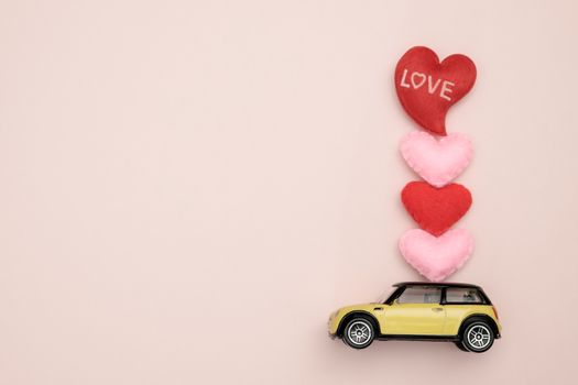 Toy car carrying heart-shape, Concept of valentine day, AF point selection.