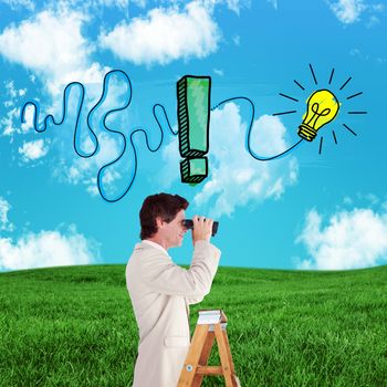 Businessman looking on a ladder against green field under blue sky