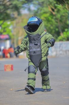 Explosive Ordnance Disposal's officer walking on the road to security check