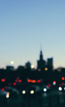 Blurry cityscape silhouette of a European city as background, evening view of Warsaw, Poland