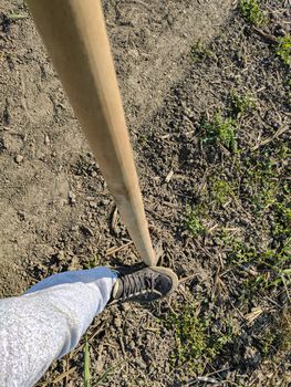Shovel on earth used by an agricultural worker in a sunny day