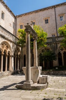 Well and cloisters of Franciscan Monastery in the old town of Dubrovnik in Croatia