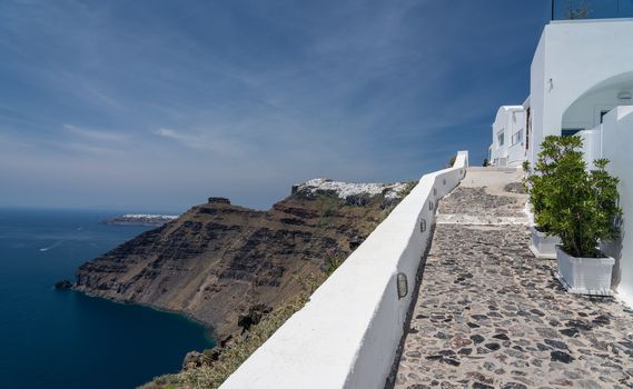 Pathway on cliff to Imerovigli and Firostefani above village of Fira on Santorini