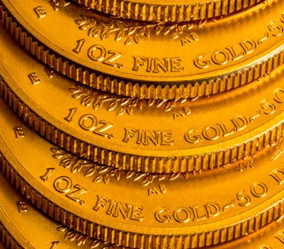 Stack of golden coins using US Treasury issue Gold Eagle one ounce pure gold coin