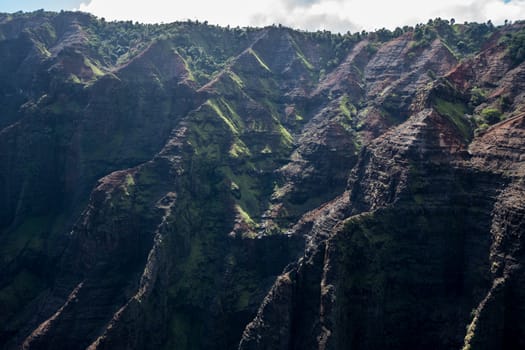 Aerial view of Waimea Canyon and landscape of hawaiian island of Kauai from helicopter flight