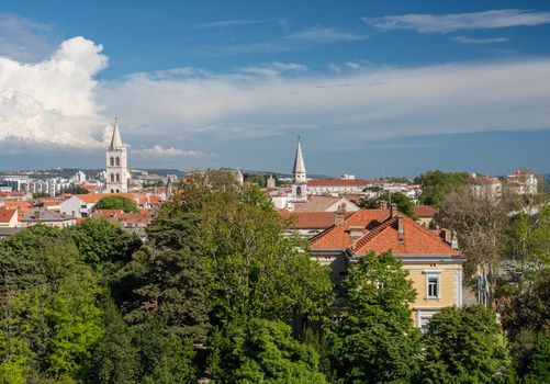 Ancient buildings and tower in the old town by the port of Zadar in Croatia