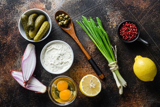 Ingredient tartar sauce organic mayonnaise, lemon,capers,parsley,dill,onion and various herbs. Over old rustic metall background Top view horisontal.