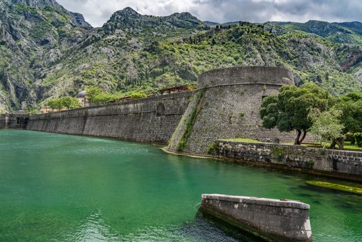 Solid stone walls surround the old town Kotor in Montenegro