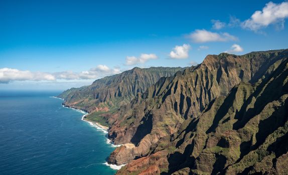 Aerial view of Na Pali coastline and landscape of hawaiian island of Kauai from helicopter flight