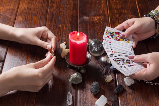 Bangkok,Thailand,March.15.20.Gypsy lays out Tarot cards and wonders for the future. Christmas fortune telling and fortune telling. Magical sessions with the telling cards and wedding rings