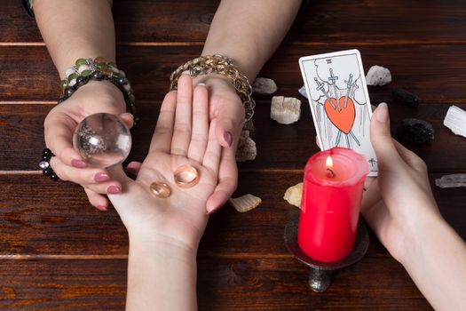 Bangkok,Thailand,March.15.20.Gypsy lays out Tarot cards and wonders for the future. Christmas fortune telling and fortune telling. Magical sessions with the telling cards and wedding rings