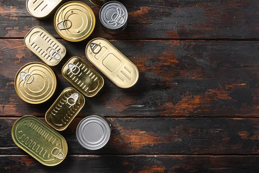 Tin cans food set top view on dark wood rustic background top view space for text