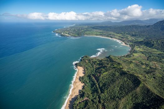 Aerial view of Hanalei Bay and Lumaha'i beach on hawaiian island of Kauai from helicopter flight