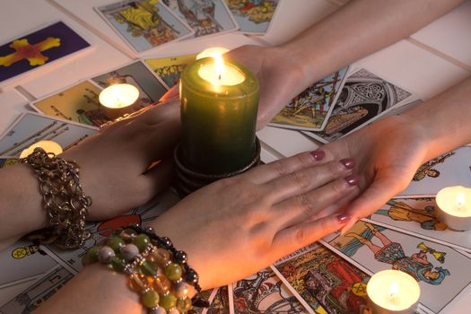 Bangkok,Thailand,March.15.20.Women's hands and Tarot cards. The Gypsy lays out Tarot cards and guesses for the future.Christmas fortune telling. Psychic at work. Magical sessions with the cards
