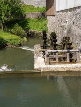 Water wheel in the park by Postojnska Jama in Slovenia