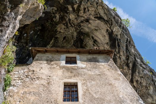 Famous castle of Predjama built into a cave in mountain in Slovenia