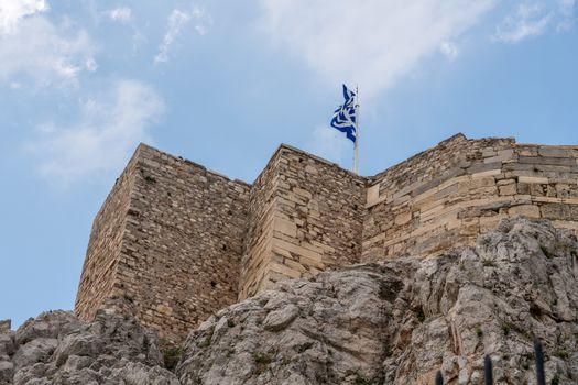 Walls of Acropolis rise above Anafiotika in Athens by the Acropolis