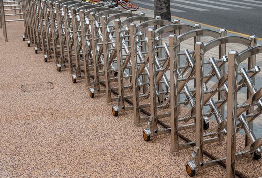 Stainless steel expandable metal fence or barrier across a street in China
