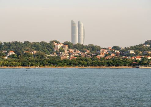 Skyline of Xiamen with Gulangyu in foreground approaching the port