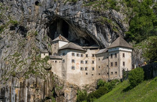 Famous castle of Predjama built into a cave in mountain in Slovenia