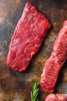 Close up Skirt Steak, Flank steak, cut near denver alternative beef steak a rustic metall background top view layflat.