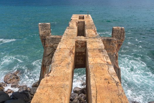 View down the old concrete pineapple dump pier by bicycle path in Kapa'a