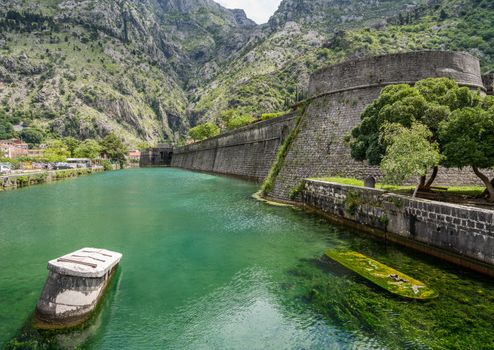 Solid stone walls surround the old town Kotor in Montenegro