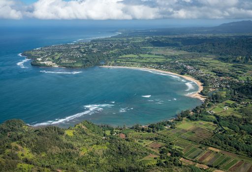 Aerial view of Hanalei Bay and Princeville on hawaiian island of Kauai from helicopter flight