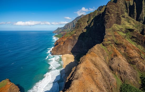 Aerial view of Na Pali coastline and landscape of hawaiian island of Kauai from helicopter flight