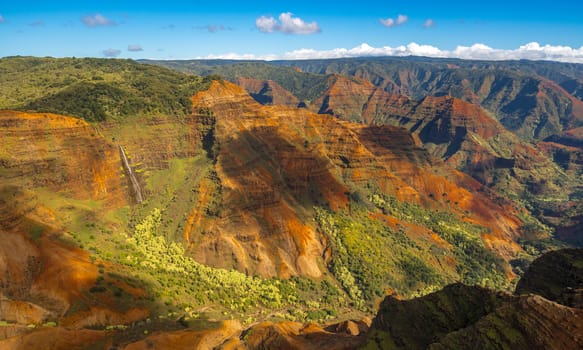 Aerial view of Waipo'o waterfall and landscape of Waimea Canyon of Kauai from helicopter flight