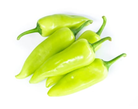 Closeup top view green chilli pepper on white background, raw food ingredient concept