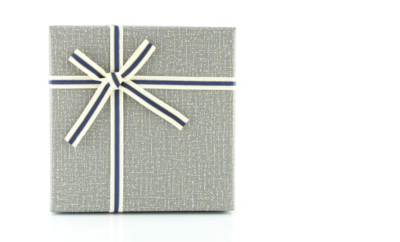 Grey gift box with ribbon on white background, copy space
