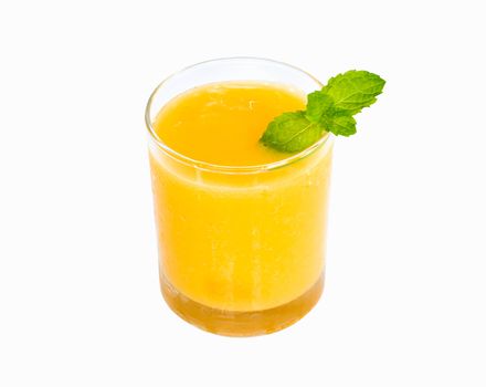 Closeup glass of mango fruit juice isolated on white background