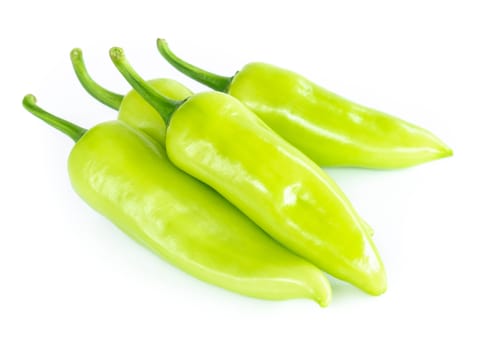 Closeup green chilli pepper on white background, raw food ingredient concept