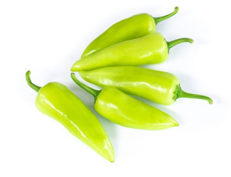 Closeup green chilli pepper on white background, raw food ingredient concept