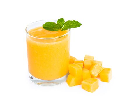 Closeup glass of mango fruit juice isolated on white background