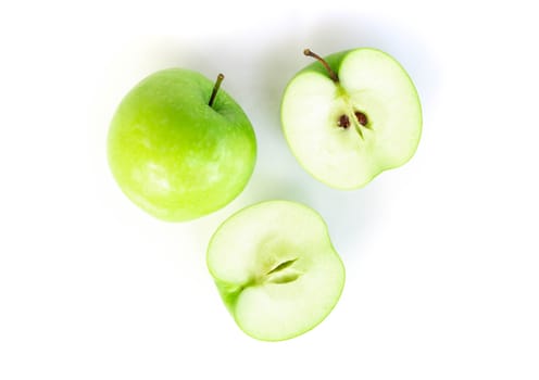 Closeup green apple with slice isolated on white background, fruit for healthy diet concept