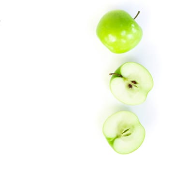 Closeup green apple with slice isolated on white background, fruit for healthy diet concept