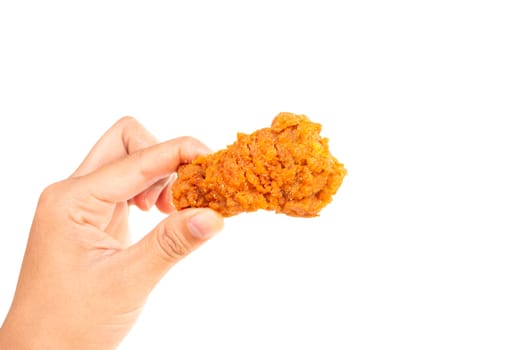 Close up woman  hand holding fried chicken leg isolated on whit background